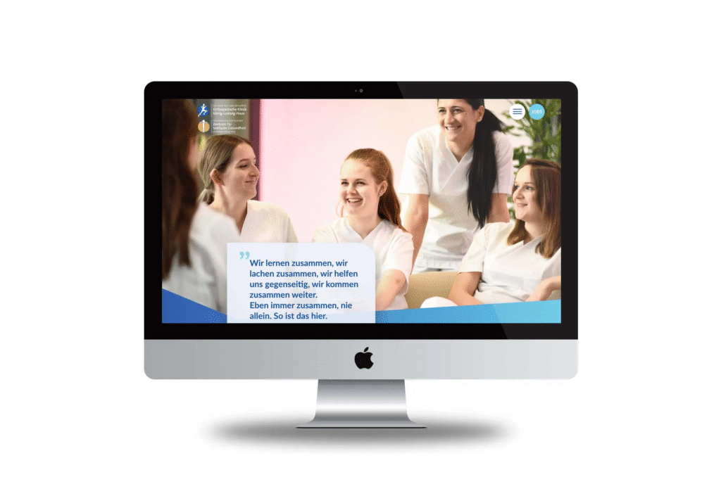 iMac zeigt eine Website-Ansicht der Fachklinik KLH mit fünf lächelnden Pflegekräften in weißer Dienstkleidung und einem Zitat über Teamzusammenhalt.